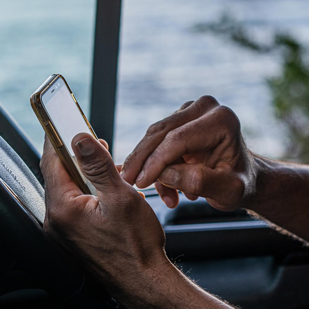 Close up of hands making phone call on mobile