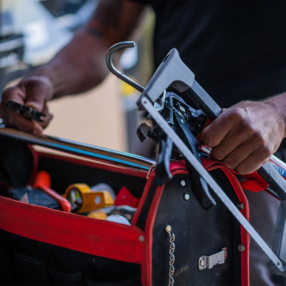 Close up of plumber with toolbox